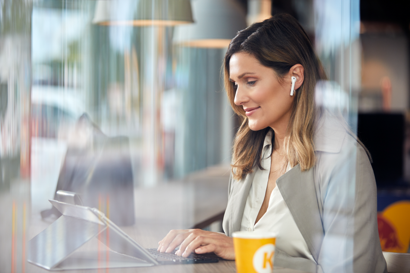 Fleet manager woman working on her tablet device with a Circle K coffee